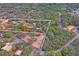 Aerial view of property showing house and surrounding land at 12404 Dolquieb Ln, Weeki Wachee, FL 34614