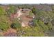 Aerial view of property showing house and surrounding land at 12404 Dolquieb Ln, Weeki Wachee, FL 34614