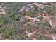 Aerial view of property showing house, detached garage, and surrounding land at 12404 Dolquieb Ln, Weeki Wachee, FL 34614