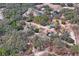 Aerial view of property showing house, detached garage, and surrounding land at 12404 Dolquieb Ln, Weeki Wachee, FL 34614