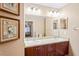 Double vanity bathroom with granite countertop at 12404 Dolquieb Ln, Weeki Wachee, FL 34614