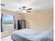 Bedroom with ceiling fan and a safe at 12404 Dolquieb Ln, Weeki Wachee, FL 34614