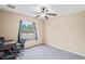 Spacious bedroom with large window and carpeted floor at 12404 Dolquieb Ln, Weeki Wachee, FL 34614