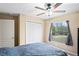 Bedroom with large window and double door closet at 12404 Dolquieb Ln, Weeki Wachee, FL 34614