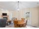 Bright dining area with round table and French doors to patio at 12404 Dolquieb Ln, Weeki Wachee, FL 34614