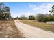 Long driveway leading to house at 12404 Dolquieb Ln, Weeki Wachee, FL 34614