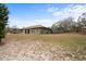 House exterior view from yard at 12404 Dolquieb Ln, Weeki Wachee, FL 34614