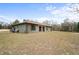 Single story home with large yard and carport at 12404 Dolquieb Ln, Weeki Wachee, FL 34614