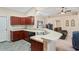 Modern kitchen with dark wood cabinets and granite countertops at 12404 Dolquieb Ln, Weeki Wachee, FL 34614