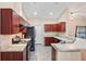 Open concept kitchen with granite countertops and breakfast bar at 12404 Dolquieb Ln, Weeki Wachee, FL 34614