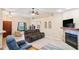 Relaxing living room featuring a fireplace and comfortable seating at 12404 Dolquieb Ln, Weeki Wachee, FL 34614