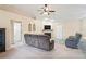 Living room with fireplace and comfy seating at 12404 Dolquieb Ln, Weeki Wachee, FL 34614