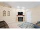 Living room with fireplace and ample space for relaxation at 12404 Dolquieb Ln, Weeki Wachee, FL 34614