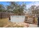 Above ground pool with wooden deck and ladder at 12404 Dolquieb Ln, Weeki Wachee, FL 34614