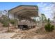 RV carport with covered parking and exterior lighting at 12404 Dolquieb Ln, Weeki Wachee, FL 34614