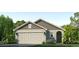 One-story home with two-car garage and landscaped lawn at 17291 Whiskey Creek Trl, Parrish, FL 34219