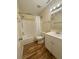 Clean bathroom with tub, shower, and vanity at 2066 Sunset Point Rd # 97, Clearwater, FL 33765