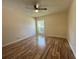Bedroom with hardwood floors and a window at 2066 Sunset Point Rd # 97, Clearwater, FL 33765