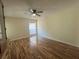Second bedroom with hardwood floors and ceiling fan at 2066 Sunset Point Rd # 97, Clearwater, FL 33765