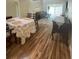 Elegant dining area with hardwood floors and spiral staircase at 2066 Sunset Point Rd # 97, Clearwater, FL 33765
