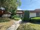 Inviting condo exterior featuring a walkway and landscaping at 2066 Sunset Point Rd # 97, Clearwater, FL 33765