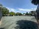 Community tennis courts nestled amongst lush greenery at 2066 Sunset Point Rd # 97, Clearwater, FL 33765