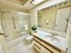 Updated bathroom with tub shower combo and vanity at 2119 Elm St # 101, Dunedin, FL 34698