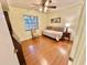 Cozy bedroom with a daybed, chair, and plenty of natural light at 2119 Elm St # 101, Dunedin, FL 34698