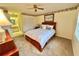 Bright bedroom with a queen-size bed and direct access to the bathroom at 2119 Elm St # 101, Dunedin, FL 34698