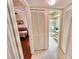 Hallway with linen closet offering access to bedrooms and bathroom at 2119 Elm St # 101, Dunedin, FL 34698