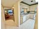 Open kitchen with view into living room and dining area at 2119 Elm St # 101, Dunedin, FL 34698