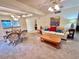 Living and dining room with neutral carpet and wood furniture at 2119 Elm St # 101, Dunedin, FL 34698