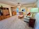 Open concept living room with comfortable seating and wood cabinet at 2119 Elm St # 101, Dunedin, FL 34698