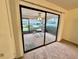 Screened patio with seating for relaxing and backyard views at 2119 Elm St # 101, Dunedin, FL 34698