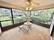 Relaxing screened porch with outdoor furniture, offering a view of the backyard at 2119 Elm St # 101, Dunedin, FL 34698