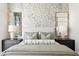 Elegant bedroom with a patterned wall and ample light at 301 1St S St # 1002, St Petersburg, FL 33701