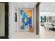 Modern hallway featuring large abstract art and tile floors at 301 1St S St # 1002, St Petersburg, FL 33701