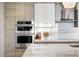 Modern kitchen with stainless steel appliances and light wood cabinetry at 301 1St S St # 1002, St Petersburg, FL 33701