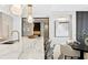Elegant kitchen with marble island, breakfast bar, and contemporary light fixtures at 301 1St S St # 1002, St Petersburg, FL 33701