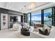 Spacious living room with stunning water views, fireplace, and comfy seating at 301 1St S St # 1002, St Petersburg, FL 33701