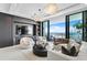 Spacious living room with stunning water views, fireplace, and comfy seating at 301 1St S St # 1002, St Petersburg, FL 33701