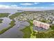 Aerial view of waterfront community, showing building, parking, and marina at 4516 Seagull Dr # 419, New Port Richey, FL 34652