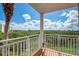 Private balcony overlooking lush trees and partial water view at 4516 Seagull Dr # 419, New Port Richey, FL 34652
