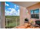 Relaxing balcony with seating for two and treetop views at 4516 Seagull Dr # 419, New Port Richey, FL 34652