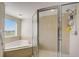Bathroom with shower, corner tub and window at 4516 Seagull Dr # 419, New Port Richey, FL 34652