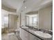 Bathroom with double vanity, shower, and a large garden tub at 4516 Seagull Dr # 419, New Port Richey, FL 34652