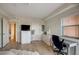 Bedroom with dresser, desk, and view of hallway at 4516 Seagull Dr # 419, New Port Richey, FL 34652