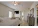 Spacious bedroom with a large TV, dresser and bathroom access at 4516 Seagull Dr # 419, New Port Richey, FL 34652