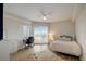 Bedroom with a queen bed, desk, and access to a balcony at 4516 Seagull Dr # 419, New Port Richey, FL 34652
