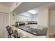 White kitchen with granite countertops and breakfast bar at 4516 Seagull Dr # 419, New Port Richey, FL 34652